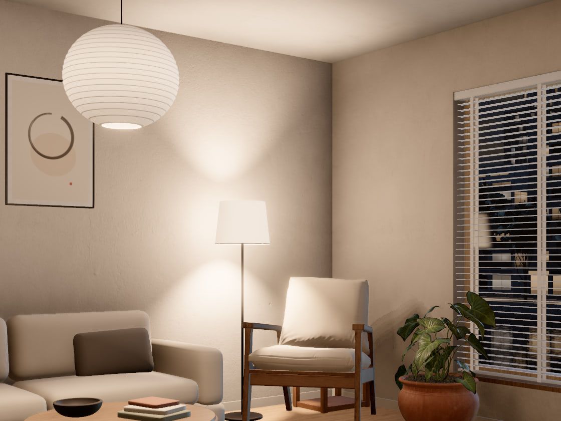 The room at night: a white paper pendant and a floor lamp glow beside an armchair, lighting the walls warm.
